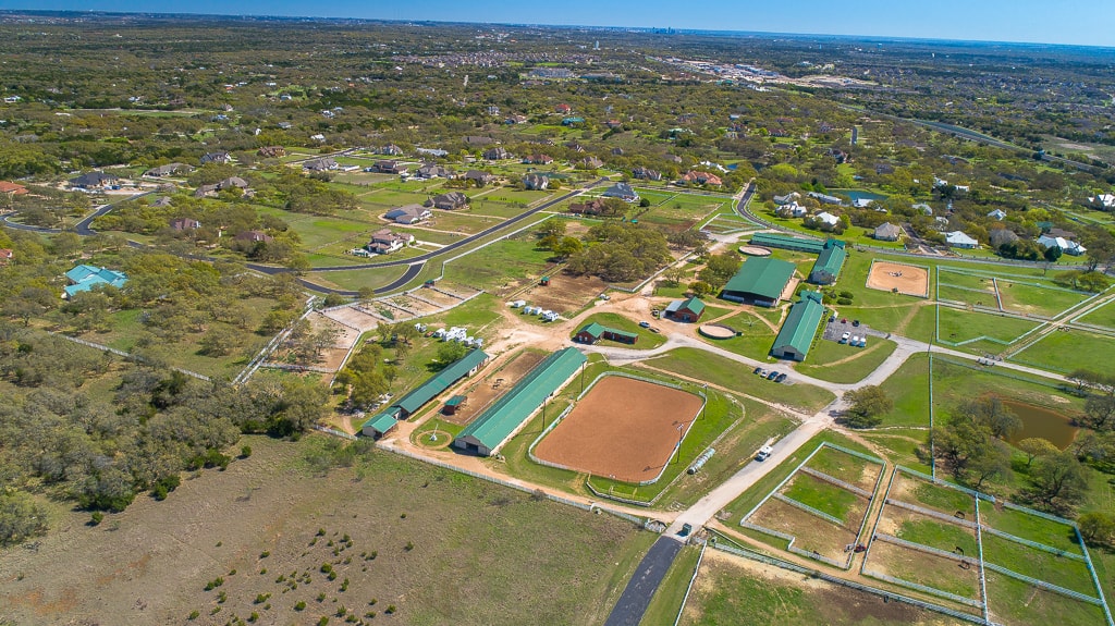 Aerial view of the Austin equestrian campus and surrounding Texas landscape