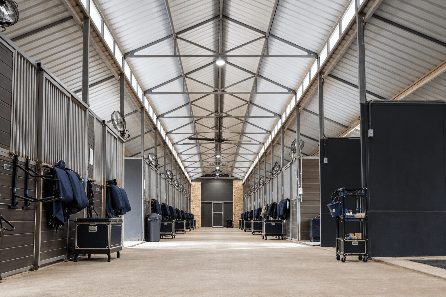 The bright central aisle of the Austin equestrian center